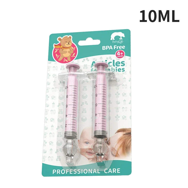 Two pink syringes in packaging with a bear illustration and text indicating 'BPA Free' and 'Professional Care'.