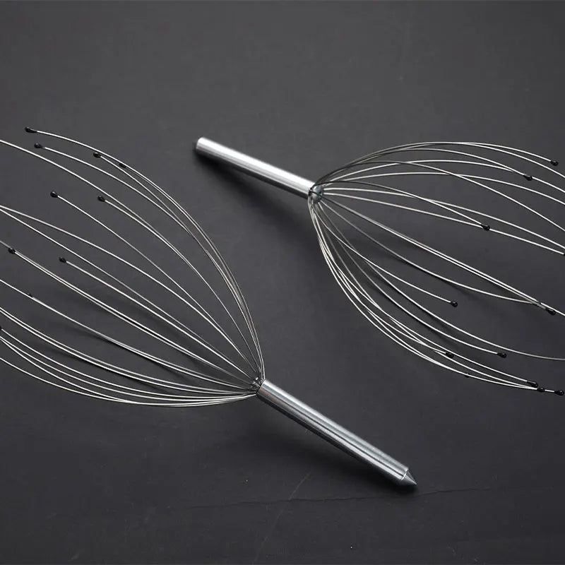 Metal massage tool on a dark background