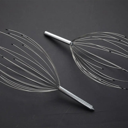 Metal massage tool on a dark background
